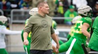 Oregon defensive coordinator Tosh Lupoi walks the field during the Oregon Ducks’ Spring Game Saturday, April 27. 2024 at Autzen Stadium in Eugene, Ore.