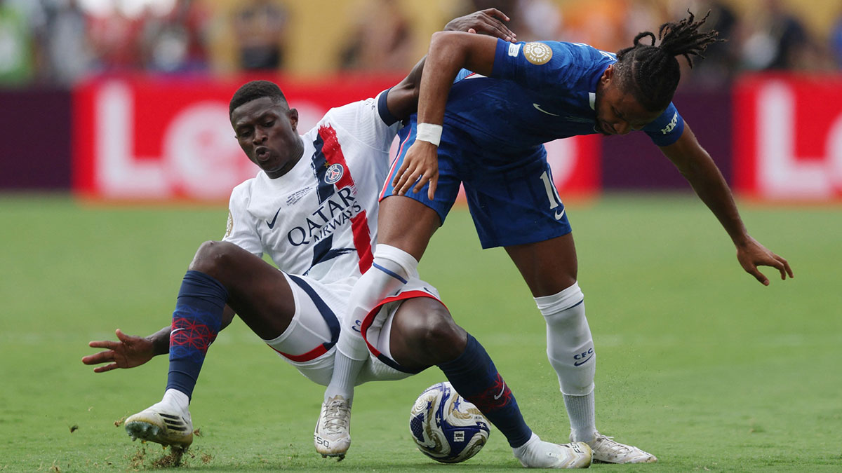 Chelsea FC forward Christopher Nkunku (18) in action with Paris Saint-Germain defender Nuno Mendes (25) during the final of the 2025 FIFA Club World Cup at MetLife Stadium.