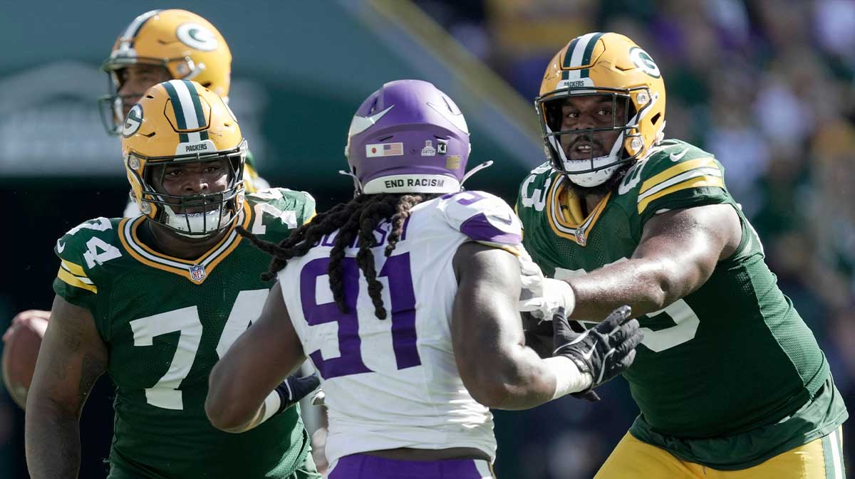 Green Bay Packers guard Elgton Jenkins (74) and offensive tackle Rasheed Walker (63) block Minnesota Vikings linebacker Pat Jones II (91) during the third quarter of their game Sunday, September 29, 2024 at Lambeau Field in Green Bay, Wisconsin. The Minnesota Vikings beat the Green Bay Packers 31-29.