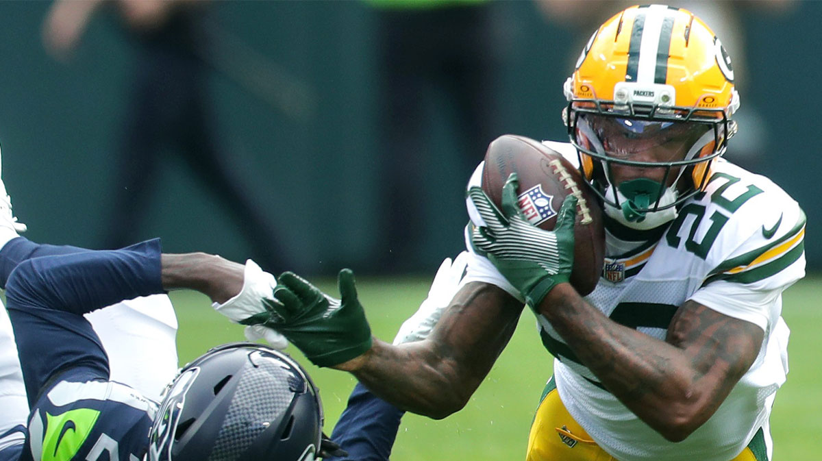 Green Bay Packers wide receiver Matthew Golden (22) catches a pass against the defense of Seattle Seahawks cornerback Nehemiah Pritchett (28) on Saturday, August 23, 2025, at Lambeau Field in Green Bay, Wis. The Packers defeated the Seahawks 20-7.