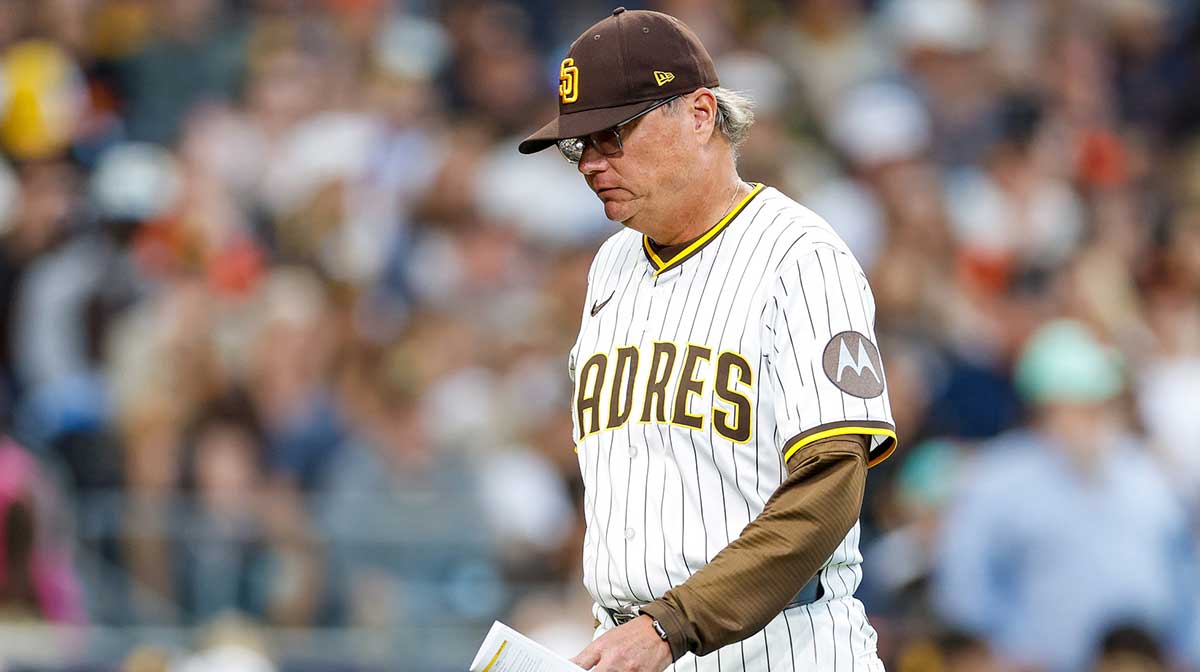 Padres manager Mike Shildt (8) walks back to the dugout after being ejected by home plate umpire James Hoye during the second inning against the San Francisco Giants at Petco Park