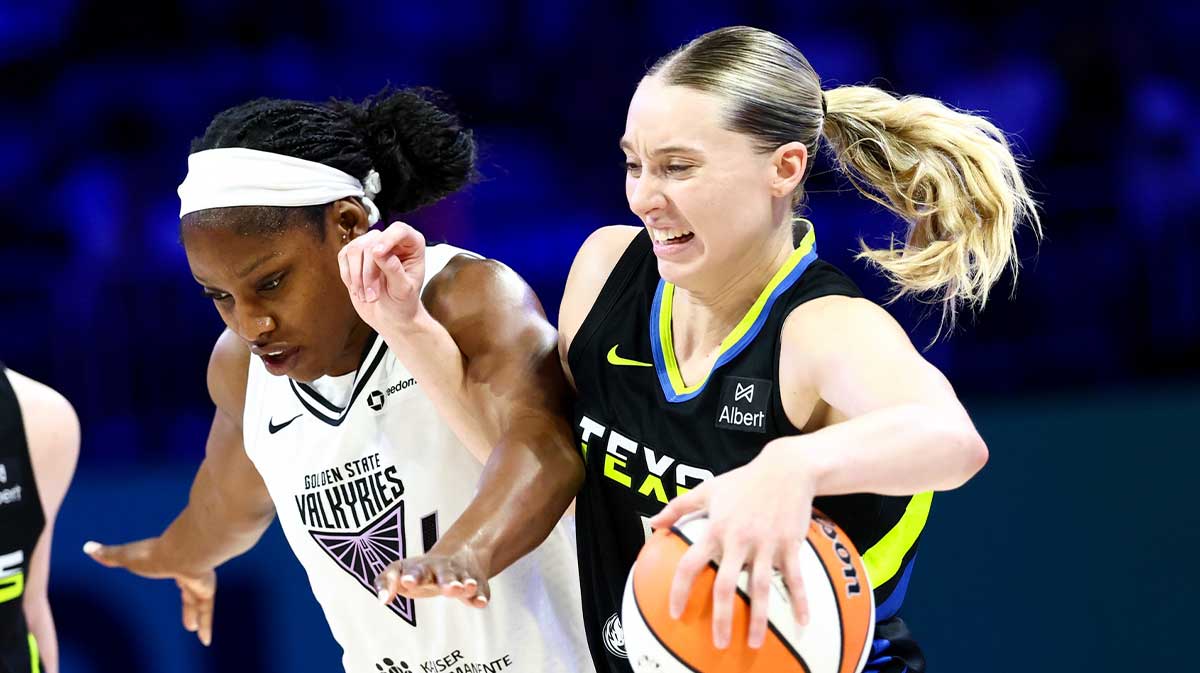 Dallas Wings guard Paige Bueckers (5) drives to the basket as Golden State Valkyries guard Kaila Charles (6) defends during the second half at College Park Center.