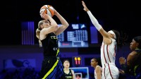 Dallas Wings guard Paige Bueckers (5) scores a basket against Washington Mystics guard Sug Sutton (1) during the second half at College Park Center.