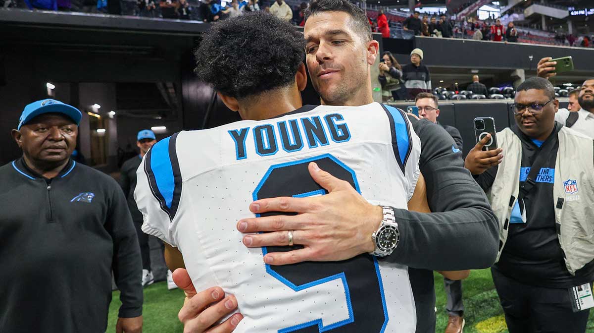 Carolina Panthers head coach Dave Canales celebrates with quarterback Bryce Young (9) after an overtime victory over the Atlanta Falcons at Mercedes-Benz Stadium.