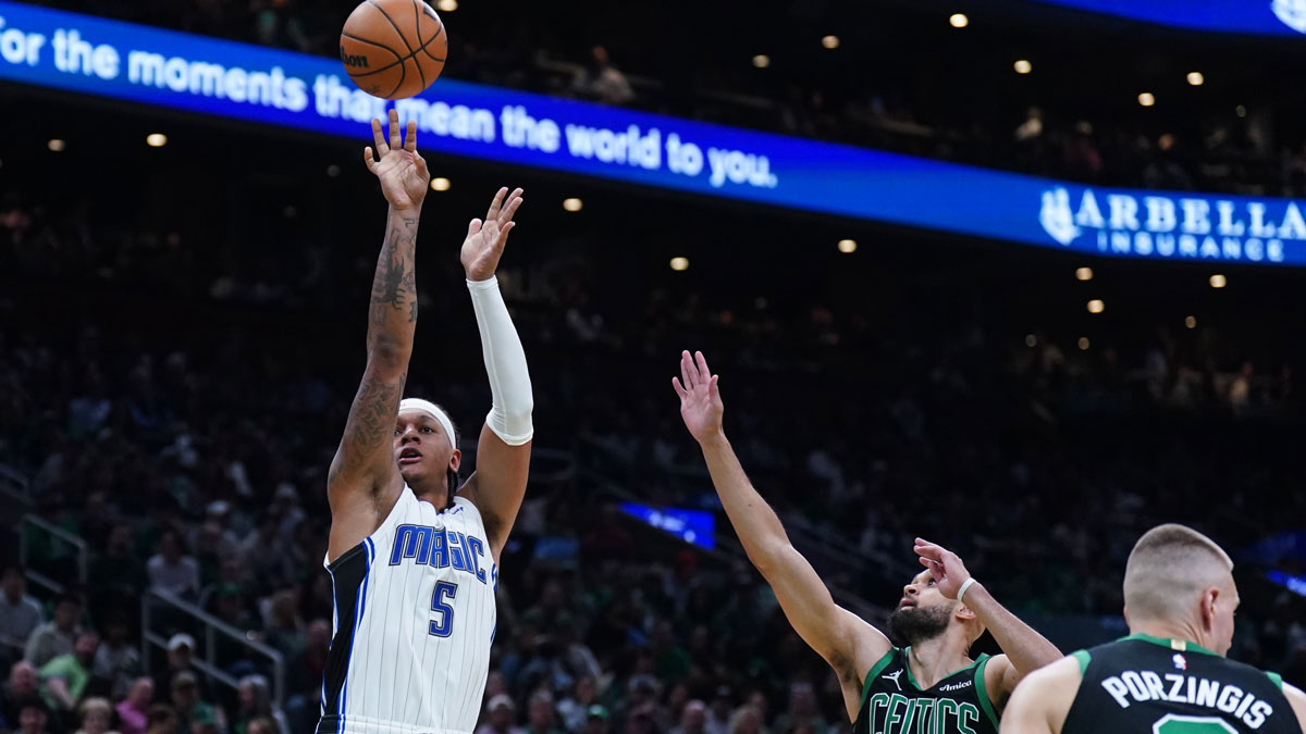 Orlando Magic forward Paolo Banchero (5) shoots the ball against Boston Celtics guard Derrick White (9) in the second quarter during game five of first round for the 2025 NBA Playoffs at TD Garden.