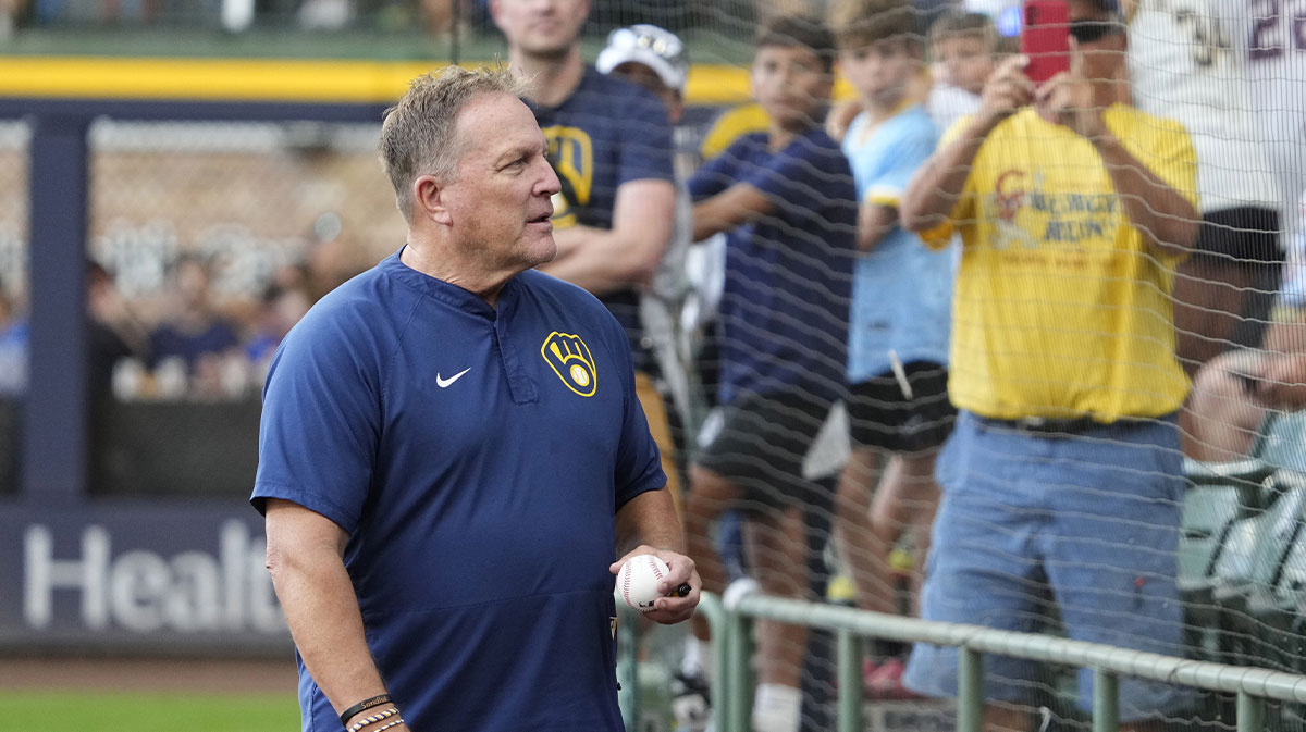 Milwaukee Brewers manager Pat Murphy (49) looks for a fan to give a ball to before a game against the Pittsburgh Pirates at American Family Field.