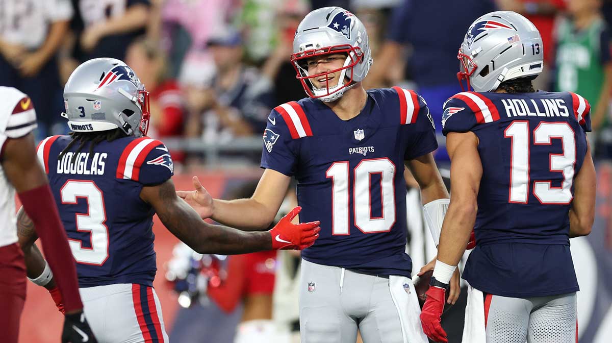 New England Patriots quarterback Drake Maye (10) celebrates after scoring a touchdown during the first half against the Washington Commanders at Gillette Stadium.