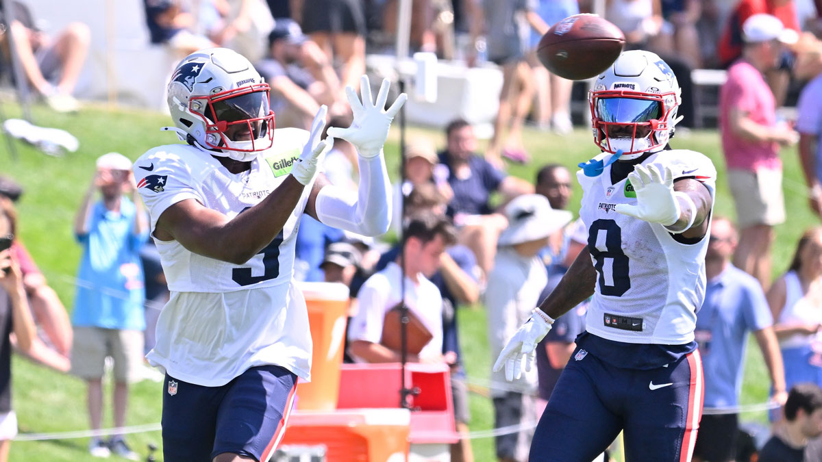 Patriots wide receiver Kayshon Boutte (9) does a drill with wide receiver Stefon Diggs (8) during training camp at Gillette Stadium with Patriots' Todd Downing in the background