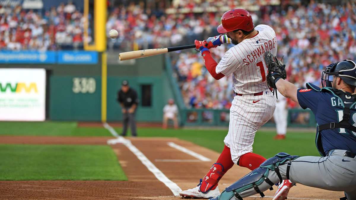 Philadelphia Phillies outfielder Kyle Schwarber (12) hits a home run during the first inning against the Seattle Mariners at Citizens Bank Park.
