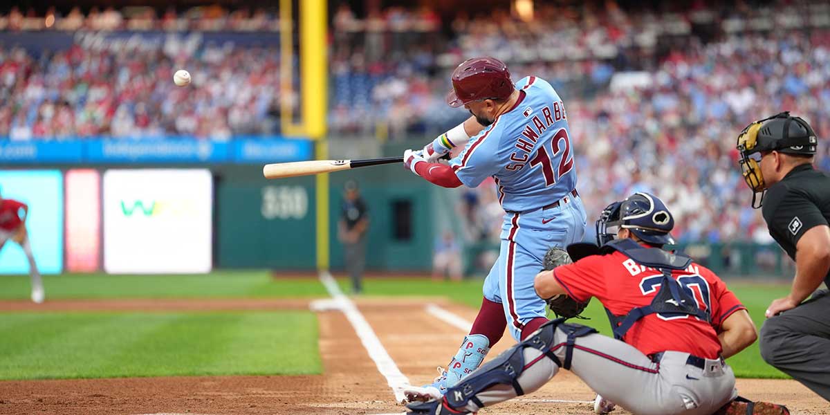Philadelphia Phillies designated hitter Kyle Schwarber (12) hits a home run against the Atlanta Braves in the first inning at Citizens Bank Park.