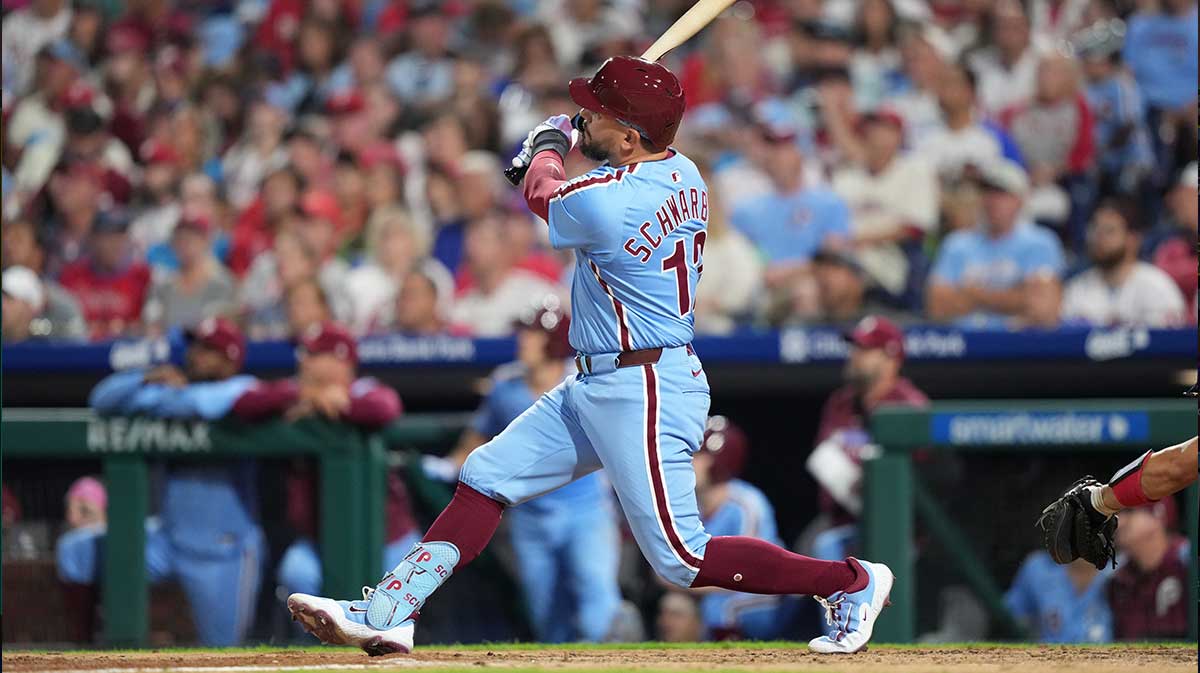 Philadelphia Phillies designated hitter Kyle Schwarber (12) hits a two-run home run against the Atlanta Braves in the fourth inning at Citizens Bank Park.