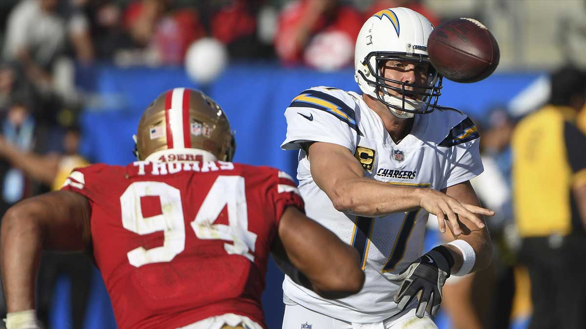 Los Angeles Chargers quarterback Philip Rivers (17) gets off a pass under pressure from San Francisco 49ers defensive end Solomon Thomas (94) during the third quarter at StubHub Center.