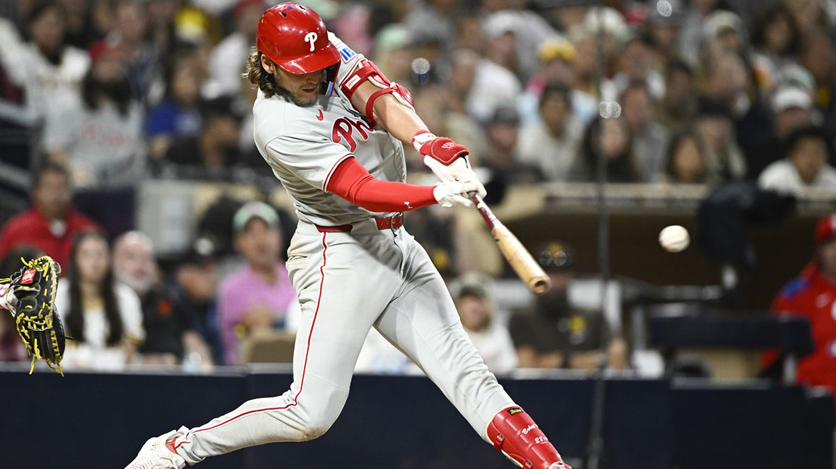Philadelphia Phillies third baseman Alec Bohm (28) hits a single during the eighth inning against the San Diego Padres at Petco Park.