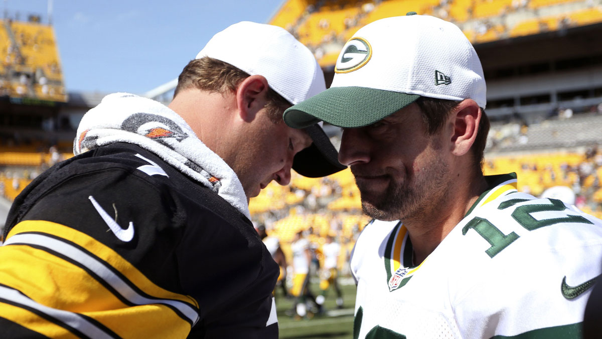 Aug 23, 2015; Pittsburgh, PA, USA; Pittsburgh Steelers quarterback Ben Roethlisberger (7) and Green Bay Packers quarterback Aaron Rodgers (12) talk on the field after their game at Heinz Field. The Steelers won 24-19. Mandatory Credit: Charles LeClaire-Imagn Images