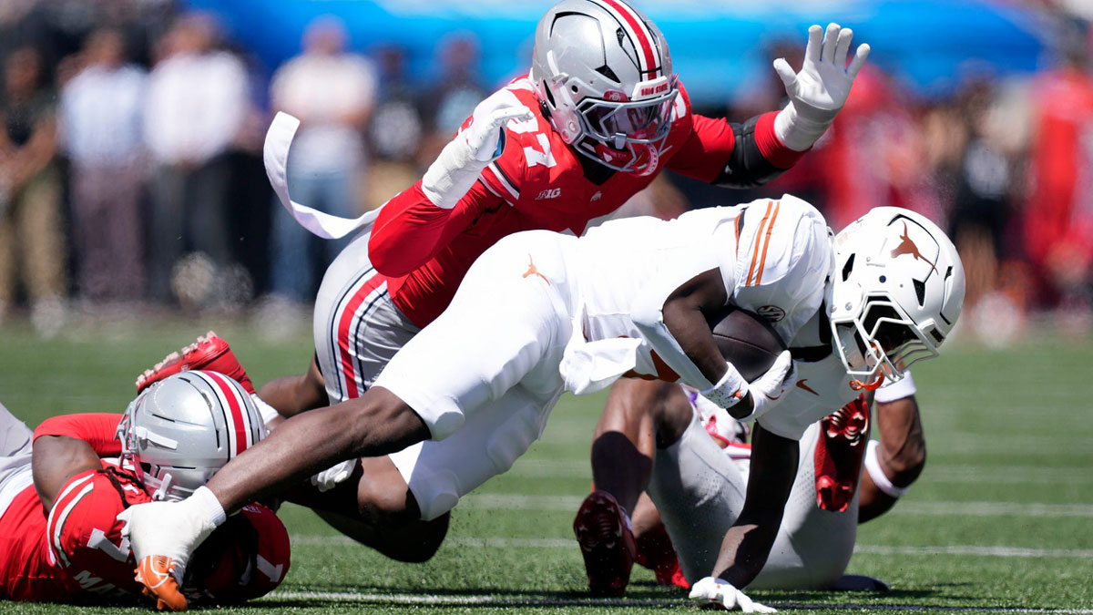 Ohio State Buckeyes defensive end Kenyatta Jackson Jr. (97) tackles Texas Longhorns running back Quintrevion Wisner (5) on a run in the third quarter of their game at Ohio Stadium in Columbus, Ohio on Aug 30, 2025.
