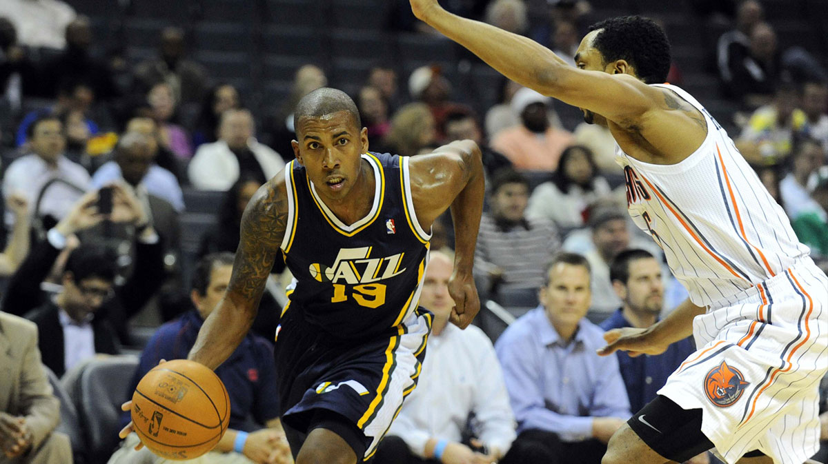 Utah Jazz guard Raja Bell (19) drives by Charlotte Bobcats guard Gerald Henderson (15) during the game at Time Warner Cable Arena. Jazz win 99-93.