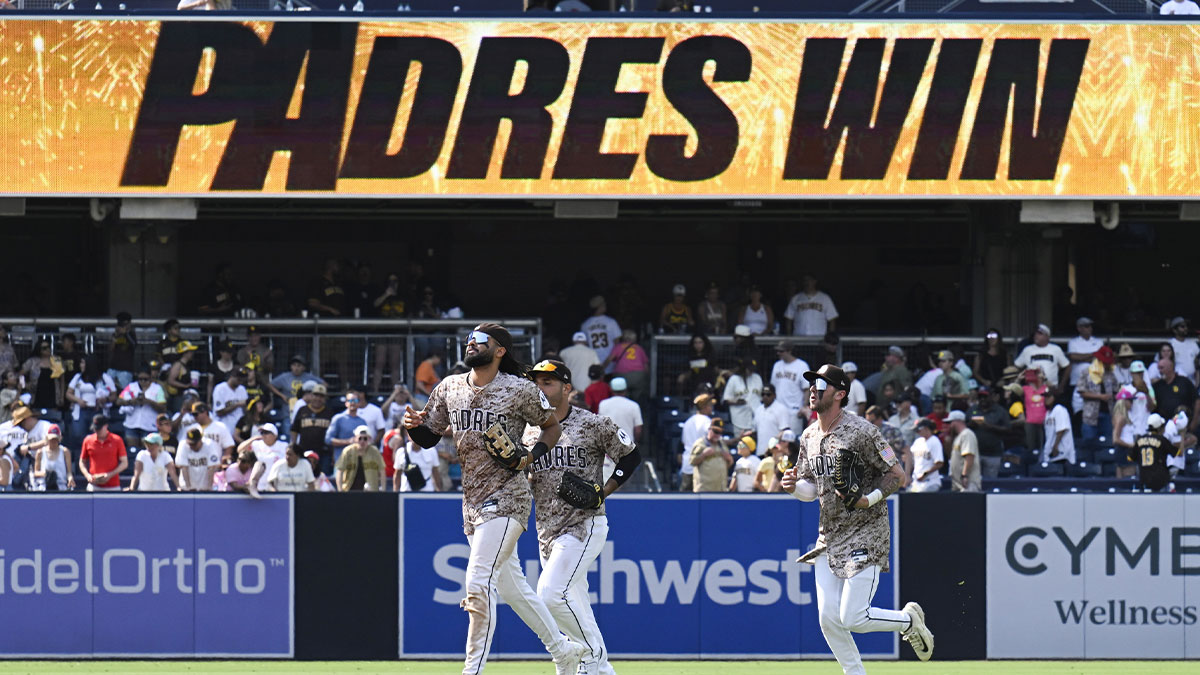 San Diego Padres right fielder Fernando Tatis Jr. (23), left, Ramon Laureano (5), center and Jackson Merrill (3) leave the field after the Padres beat the St. Louis Cardinals at Petco Park.