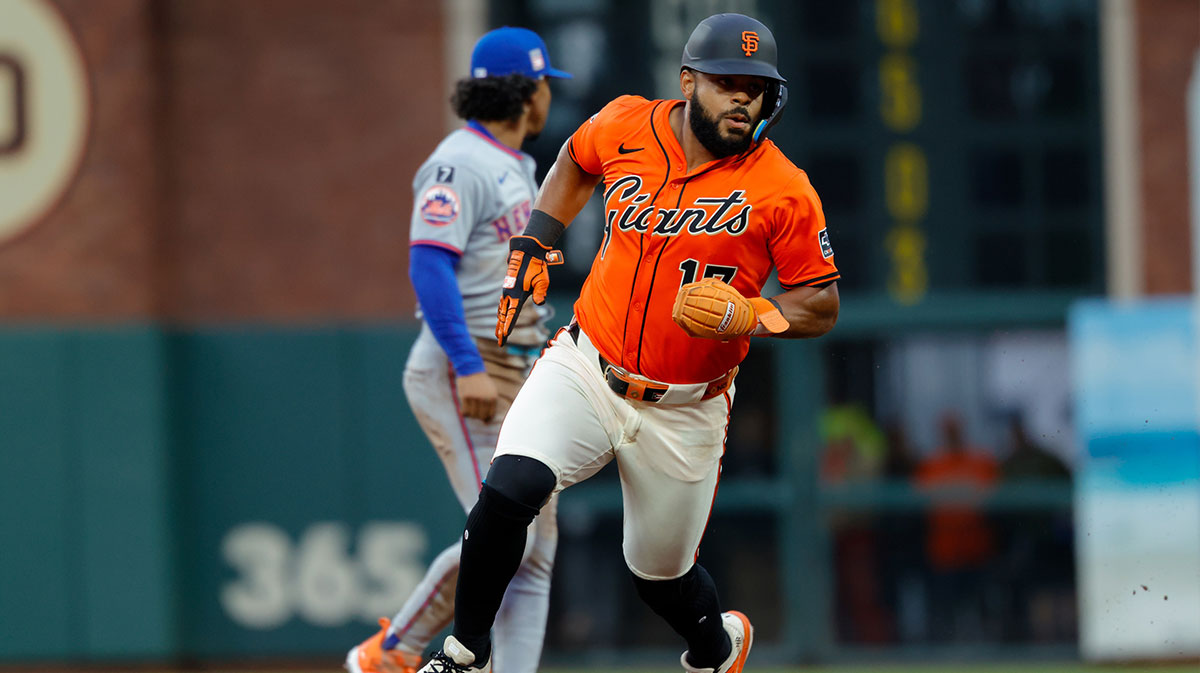San Francisco Giants left fielder Heliot Ramos (17) advances to third base on a double by first baseman Rafael Devers (16) during the first inning against the New York Mets at Oracle Park.