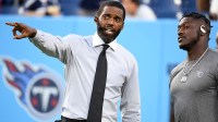 Hall of Fame receiver Randy Moss talks with Tennessee Titans wide receiver A.J. Brown (11) before the game against the Buffalo Bills at Nissan Stadium. Mandatory Credit: Christopher Hanewinckel-Imagn Images
