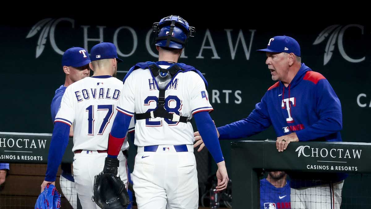 Texas Rangers manager Bruce Bochy (15) congratulates Texas Rangers starting pitcher Nathan Eovaldi (17) during the sixth inning against the Oakland Athletics at Globe Life Field.