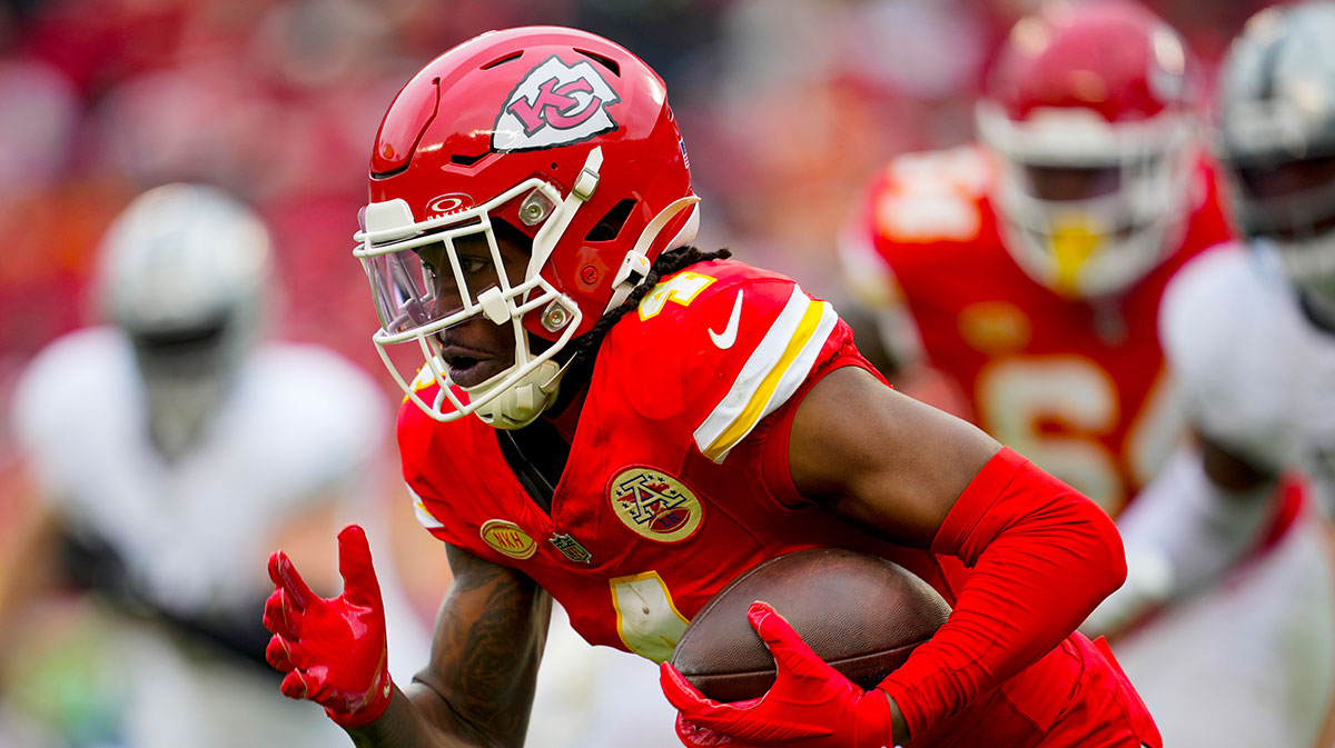 Kansas City Chiefs wide receiver Rashee Rice (4) runs with the ball against the Las Vegas Raiders during the first half at GEHA Field at Arrowhead Stadium.