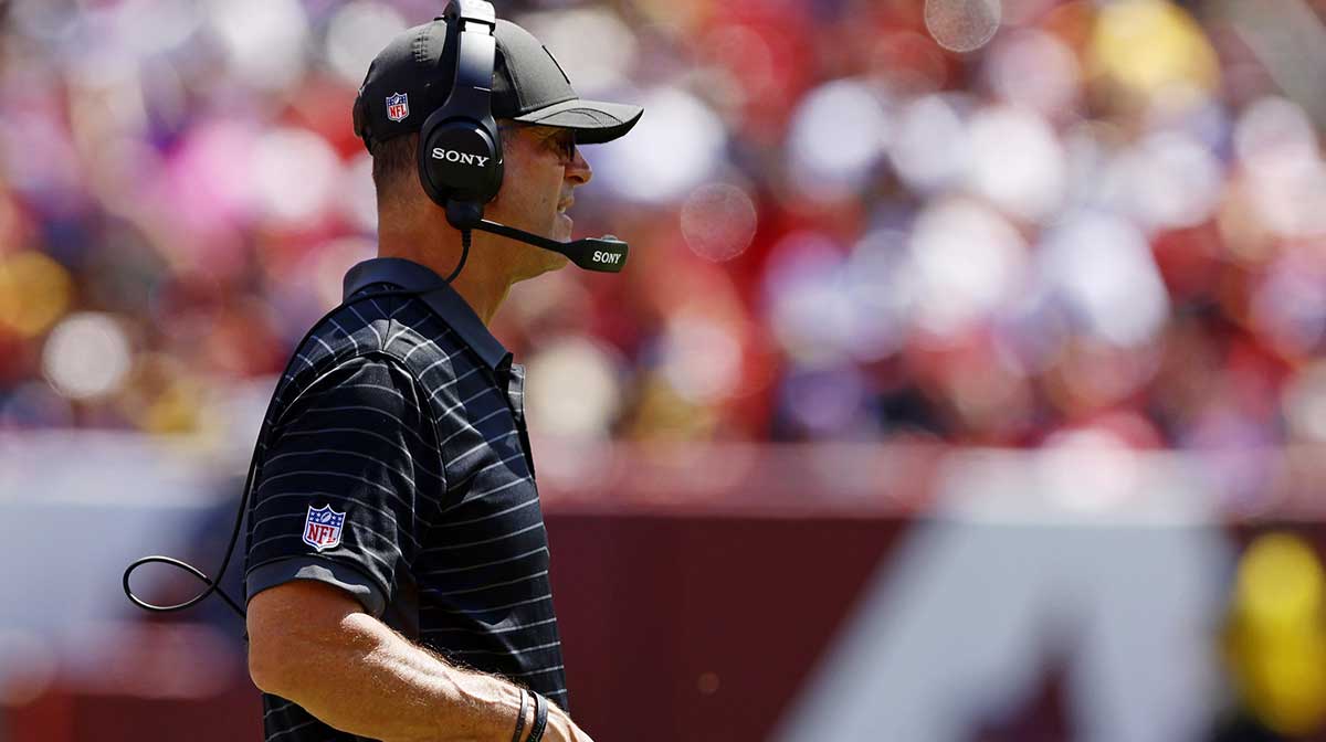 Baltimore Ravens head coach John Harbaugh looks on from the sidelines during the second quarter against the Washington Commanders at Northwest Stadium. 
