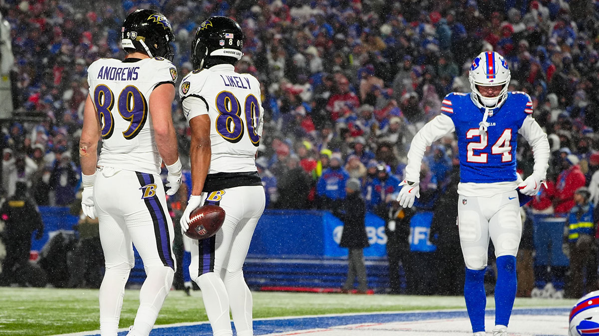 Baltimore Ravens tight end Isaiah Likely (80) celebrates with Baltimore Ravens tight end Mark Andrews (89) after scoring a touchdown during the fourth quarter against the Buffalo Bills in a 2025 AFC divisional round game at Highmark Stadium.