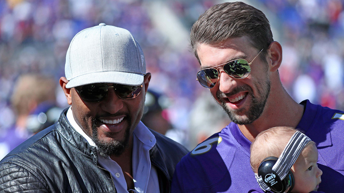 Oct 9, 2016; Baltimore, MD, USA; Ray Lewis (left) and United States olympian Michael Phelps (right) with his son Boomer attend the Washington Redskins game against the Baltimore Ravens at M&T Bank Stadium. Mandatory Credit: Mitch Stringer-Imagn Images