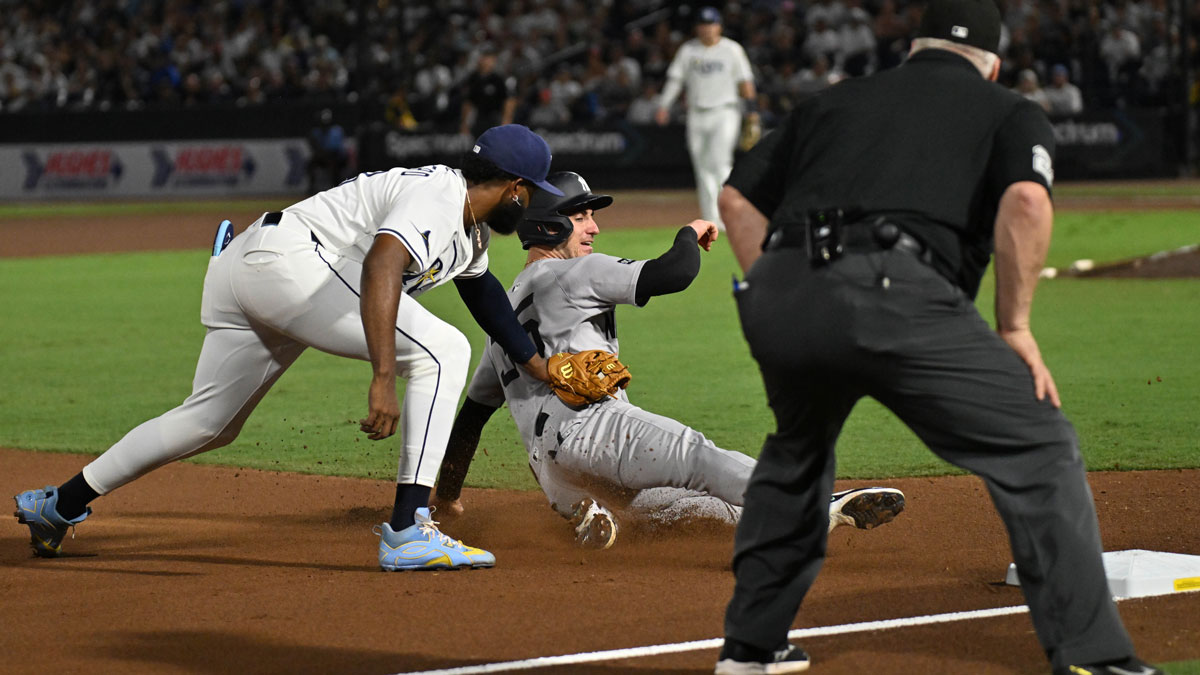 New York Yankees right fielder Cody Bellinger (35) gets tagged out by Tampa Bay Rays third baseman Junior Caminero (13) in the fourth inning at George M. Steinbrenner Field.