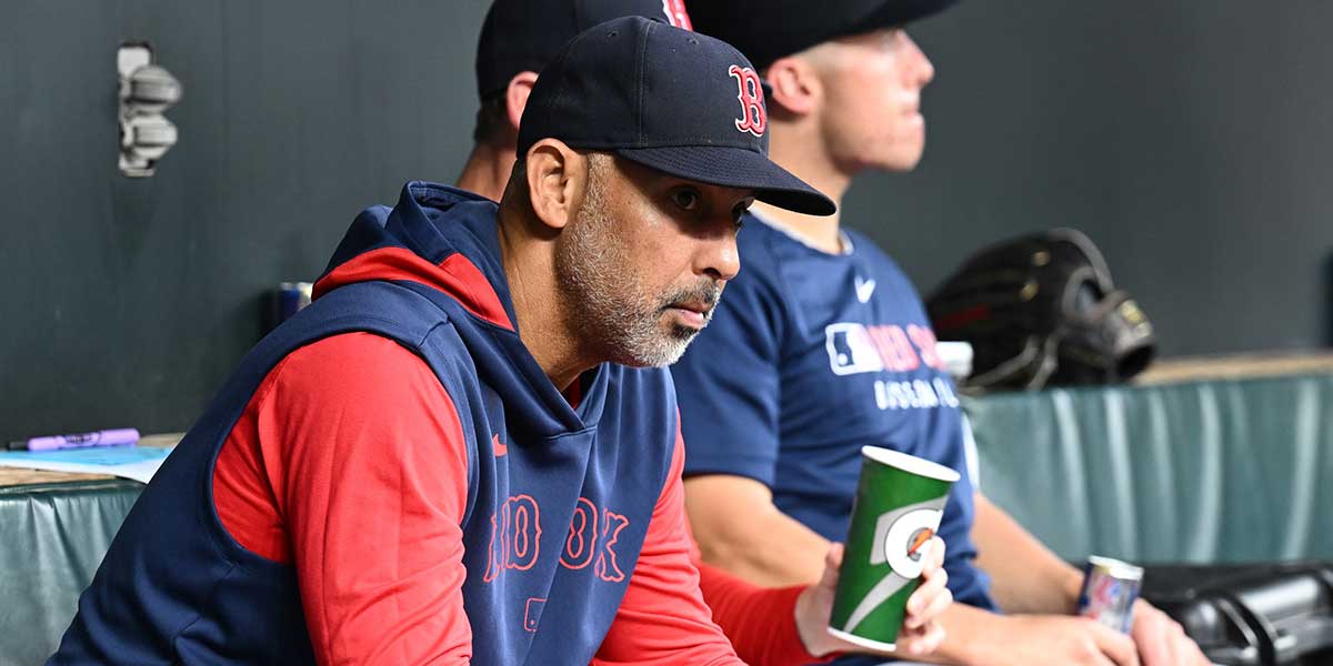 Red Sox manager Alex Cora (13) sits in the dugout before the game between the Baltimore Orioles and the Boston Red Sox at Oriole Park at Camden Yards