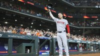Boston Red Sox third baseman Alex Bregman (2) waives to the crowd after being honored with a video tribute before the game against the Houston Astros at Daikin Park.