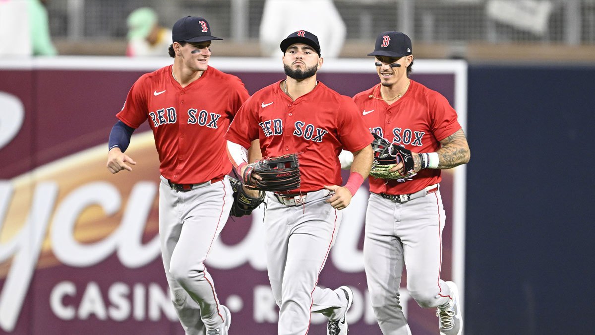 Boston Red Sox right fielder Roman Anthony (19), left, Wilyer Abreu (52), center, and Jarren Duran (16) leave the field after the Red Sox beat the San Diego Padres at Petco Park.