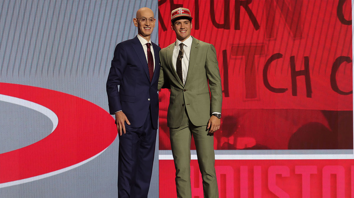 Reed Sheppard poses for photos with NBA commissioner Adam Silver after being selected in the first round by the Houston Rockets in the 2024 NBA Draft at Barclays Center.