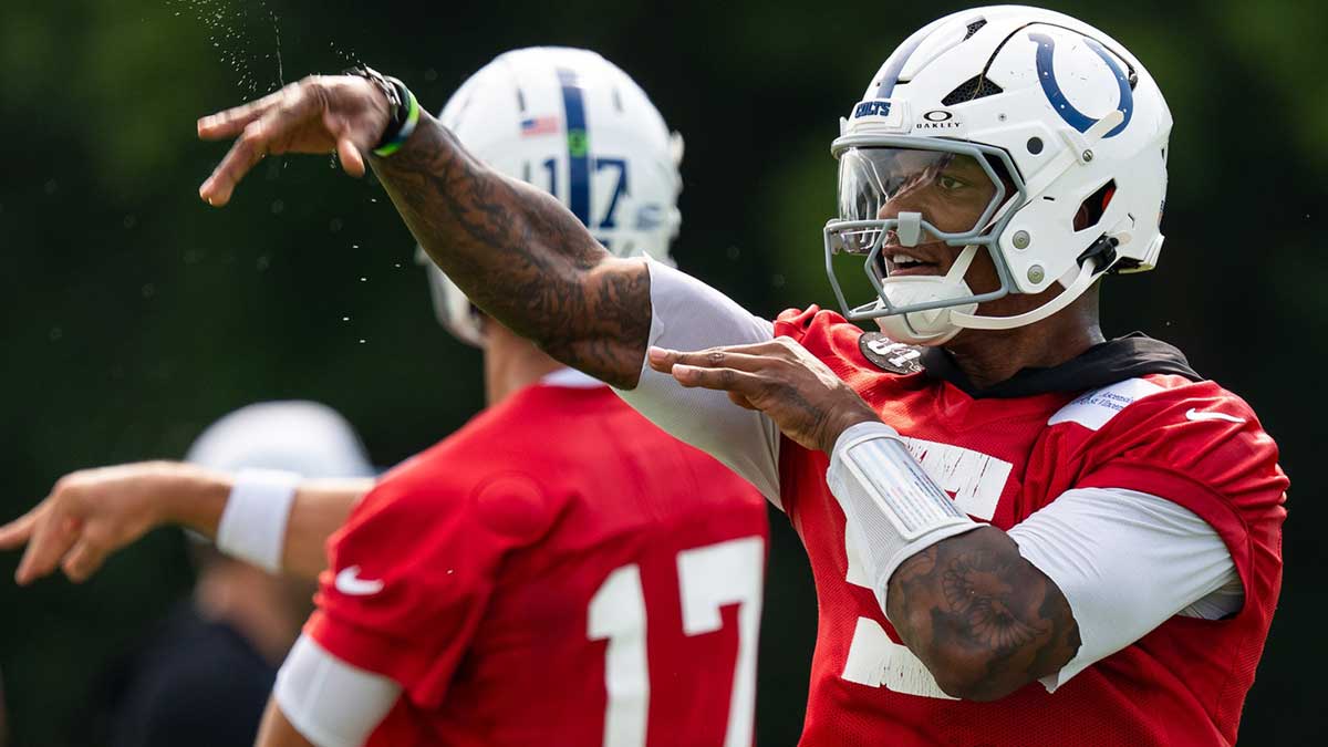 Indianapolis Colts quarterbacks Anthony Richardson Sr. (5) and Daniel Jones (17) pass Friday, July 25, 2025, during training camp held at Grand Park in Westfield.