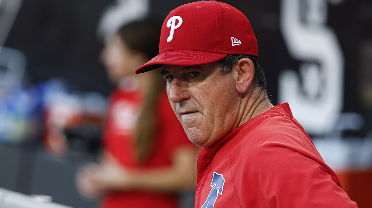 Philadelphia Phillies manager Rob Thomson (59) looks on from the dugout before a baseball game against the Chicago White Sox at Rate Field.