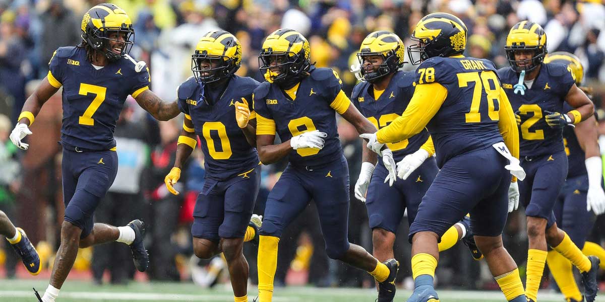 Michigan defensive back Rod Moore (9) celebrates an interception against Indiana during the first half at Michigan Stadium