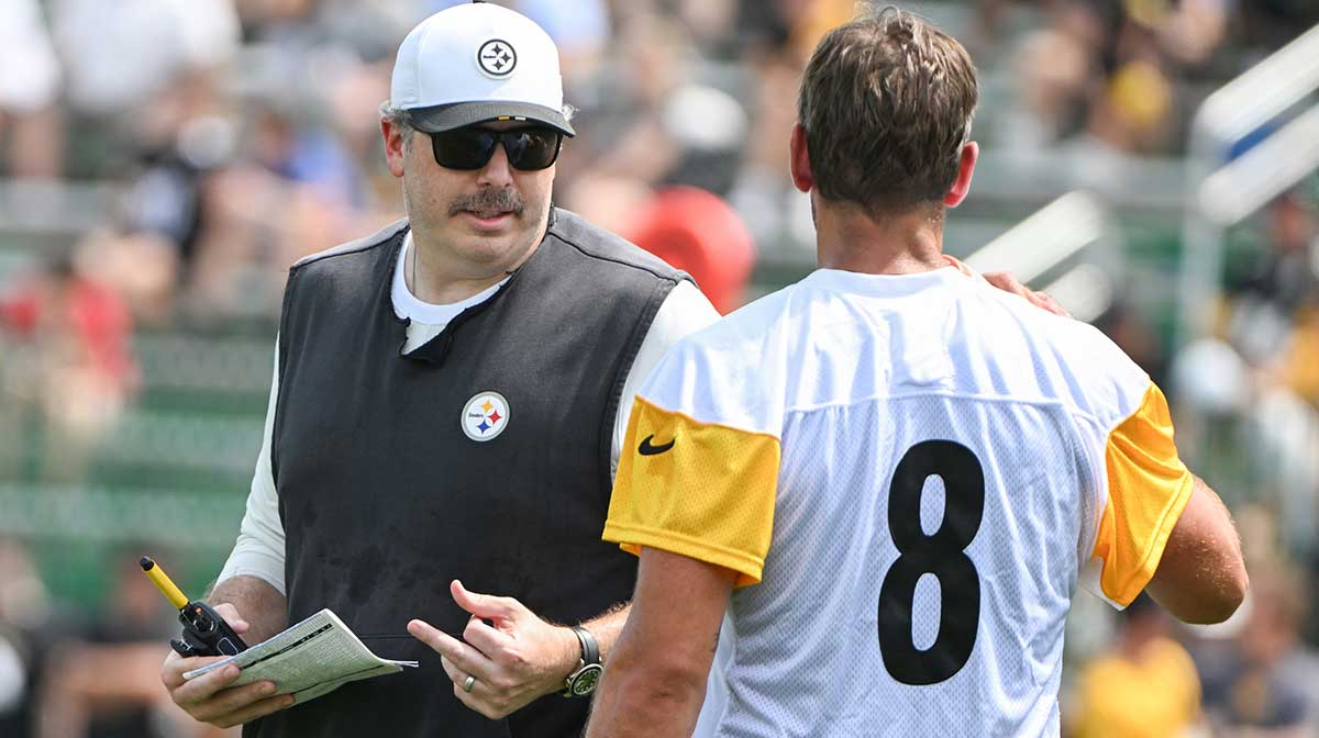 Pittsburgh Steelers offensive coordinator Arthur Smith talks with quarterback Aaron Rodgers (8) during drills at training camp at Saint Vincent College.