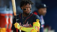 Atlanta Braves designated hitter Ronald Acuna (13) swings his bat inside the dugout against the Miami Marlins during the fourth inning at loanDepot Park.