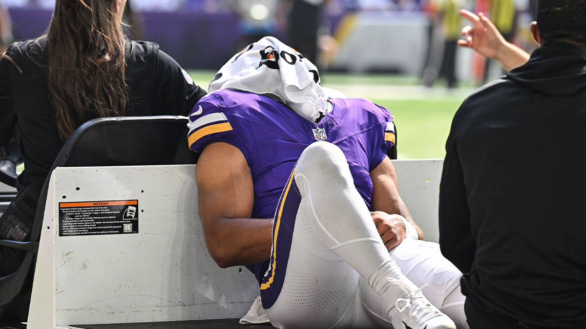 Minnesota Vikings wide receiver Rondale Moore (4) is carted off the field after suffering a lower leg injury during the second quarter against the Houston Texans at U.S. Bank Stadium
