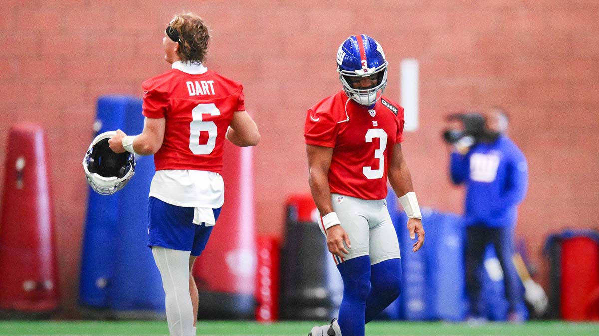 New York Giants quarterback Jaxson Dart (6) and quarterback Russell Wilson (3) interact during minicamp at Quest Diagnostics Training Center.