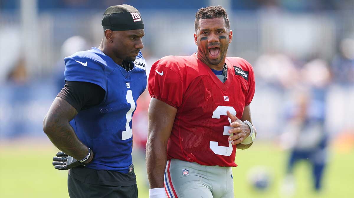 New York Giants wide receiver Malik Nabers (1) talks with quarterback Russell Wilson (3) during training camp at Quest Diagnostics Training Center. Mandatory Credit: Vincent Carchietta-Imagn Images