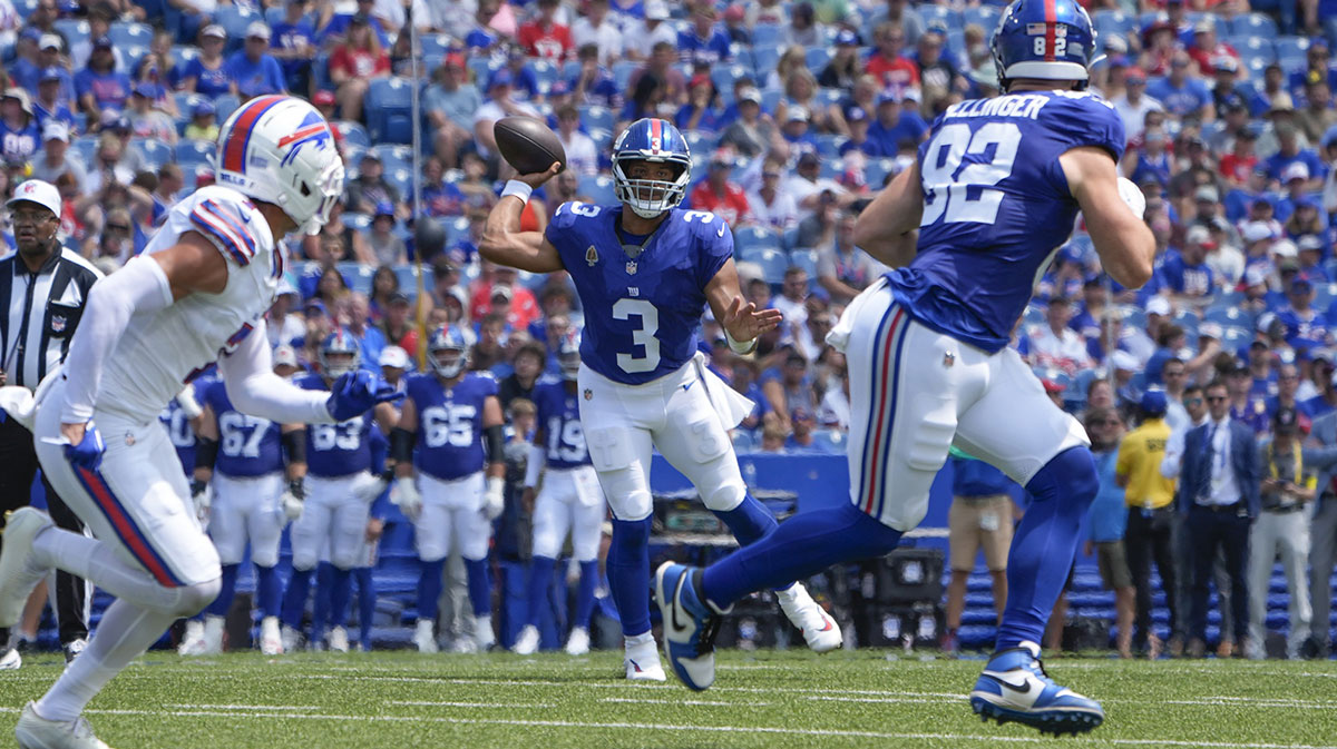 New York Giants quarterback Russell Wilson (3) throws the ball to New York Giants tight end Daniel Bellinger (82) during the first half against the Buffalo Bills at Highmark Stadium.