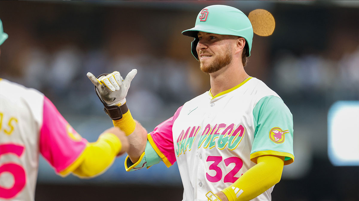 San Diego Padres designated hitter Ryan O'Hearn (32) celebrates with the dugout after hitting a single during the second inning against the Los Angeles Dodgers at Petco Park.