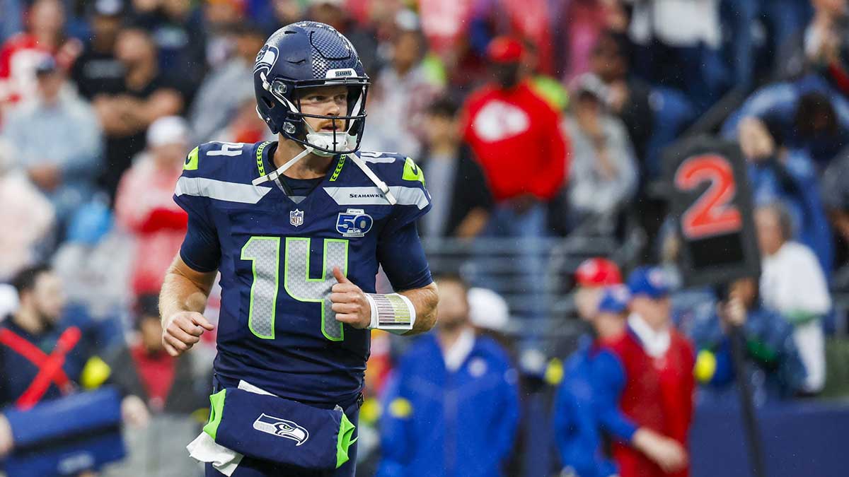 Seattle Seahawks quarterback Sam Darnold (14) reacts following a rushing touchdown by a teammate against the Kansas City Chiefs during the first quarter at Lumen Field.