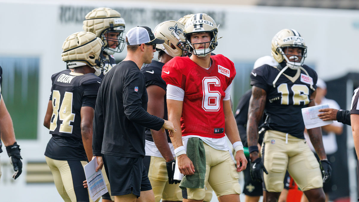 New Orleans Saints quarterback Tyler Shough (6) talks to New Orleans Saints quarterback coach Scott Tolzien during training camp at Ochsner Sports Performance Center.