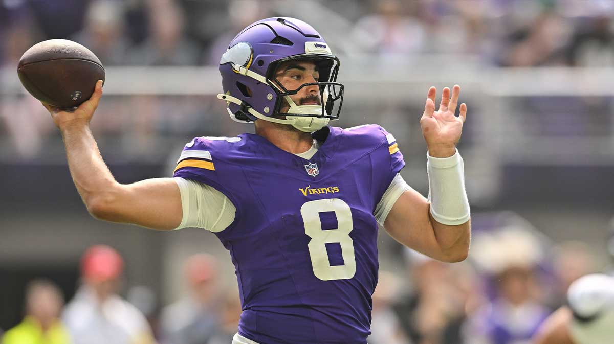 Minnesota Vikings quarterback Sam Howell (8) throws a pass against the Houston Texans during the second quarter at U.S. Bank Stadium.