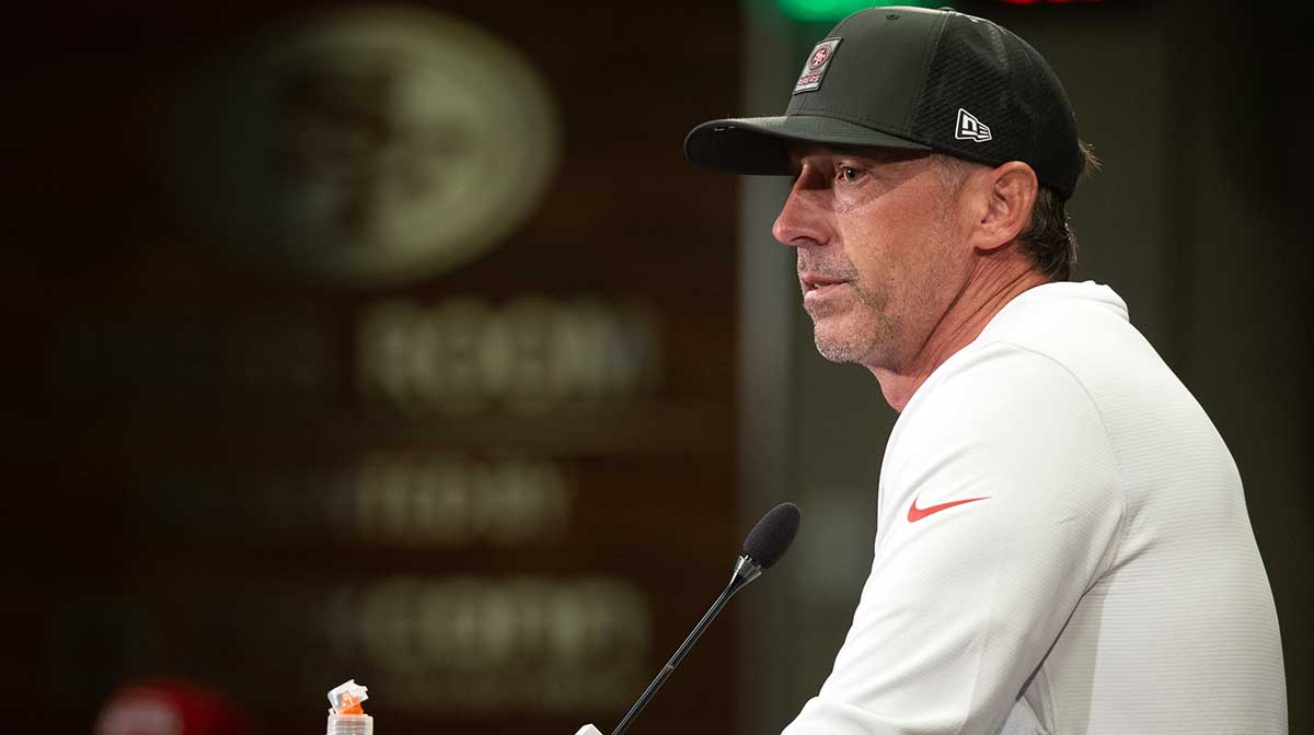 San Francisco 49ers head coach Kyle Shanahan answers questions from reporters following the first day of training camp at SAP Performance Facility.