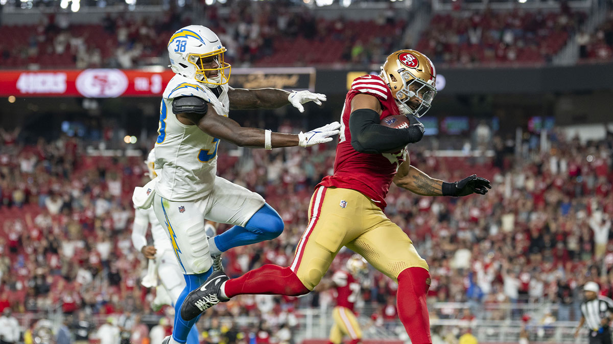 San Francisco 49ers linebacker Curtis Robinson (59) scores a touchdown off an interception against Los Angeles Chargers wide receiver Dalevon Campbell (38) during the fourth quarter at Levi's Stadium.