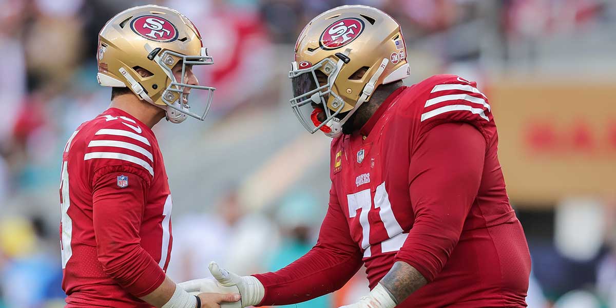 San Francisco 49ers quarterback Brock Purdy (13) celebrates with offensive tackle Trent Williams (71) after a touchdown during the second quarter at Levi's Stadium.