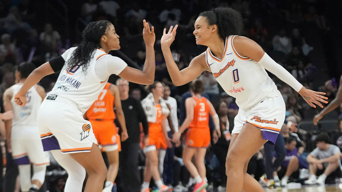 Phoenix Mercury guard Monique Akoa Makani (8) celebrates a three point basket with forward Satou Sabally (0) against the Connecticut Sun during the third quarter in Phoenix, at PHX Arena on Aug 5, 2025.